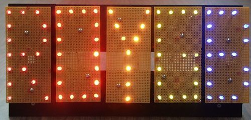 Letters outlined using red, orange, yellow, green, and blue LEDs